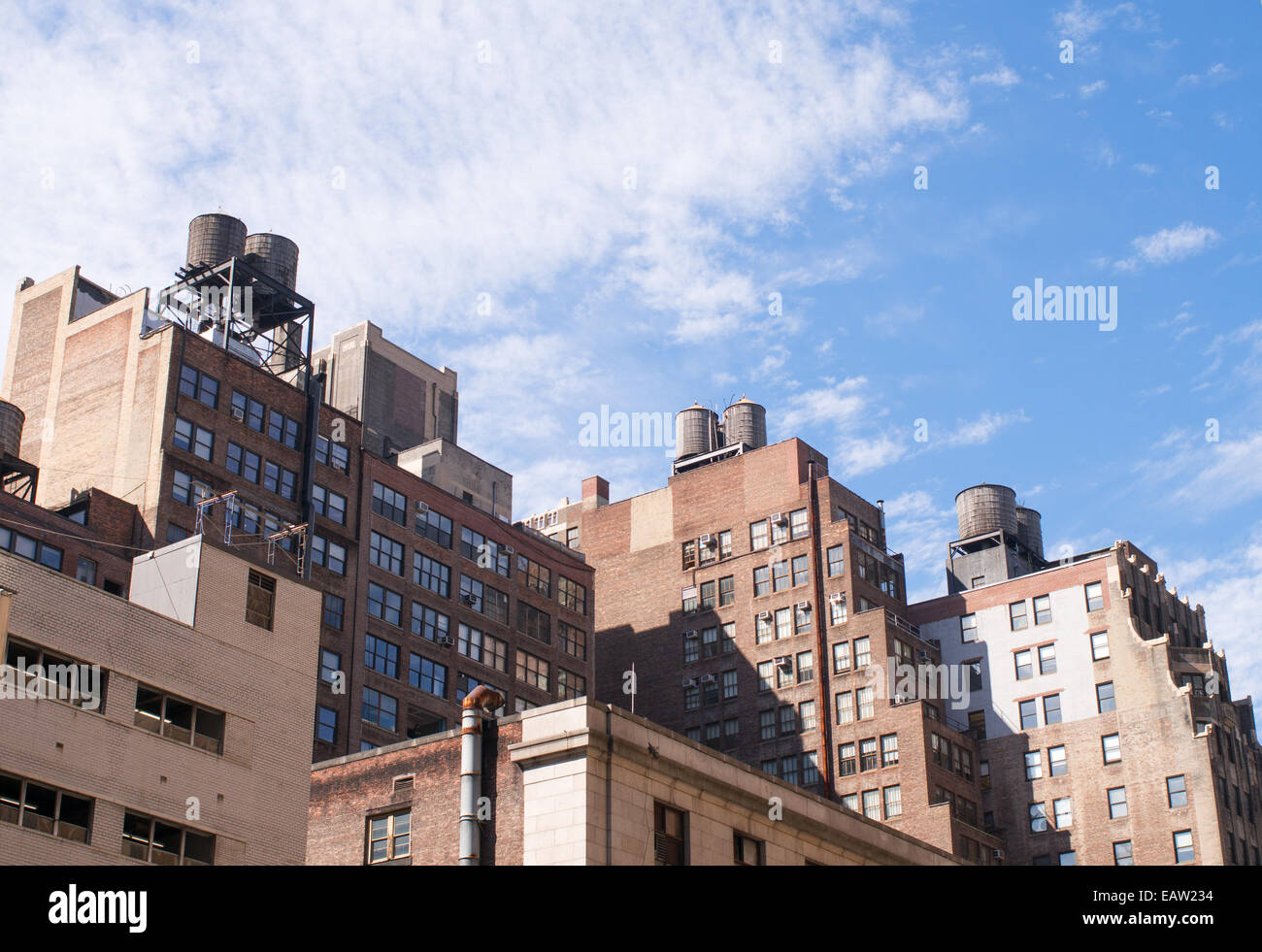 Water storage tanks on the top of brick buildings Brooklyn, New York city, USA Stock Photo