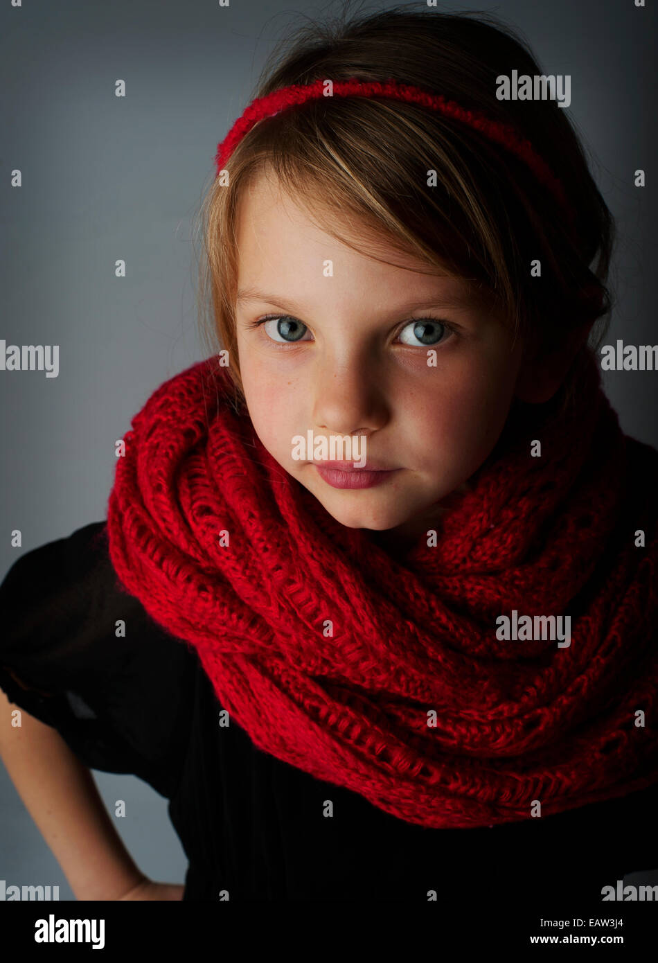 A girl in a red scarf in a studio Stock Photo Alamy