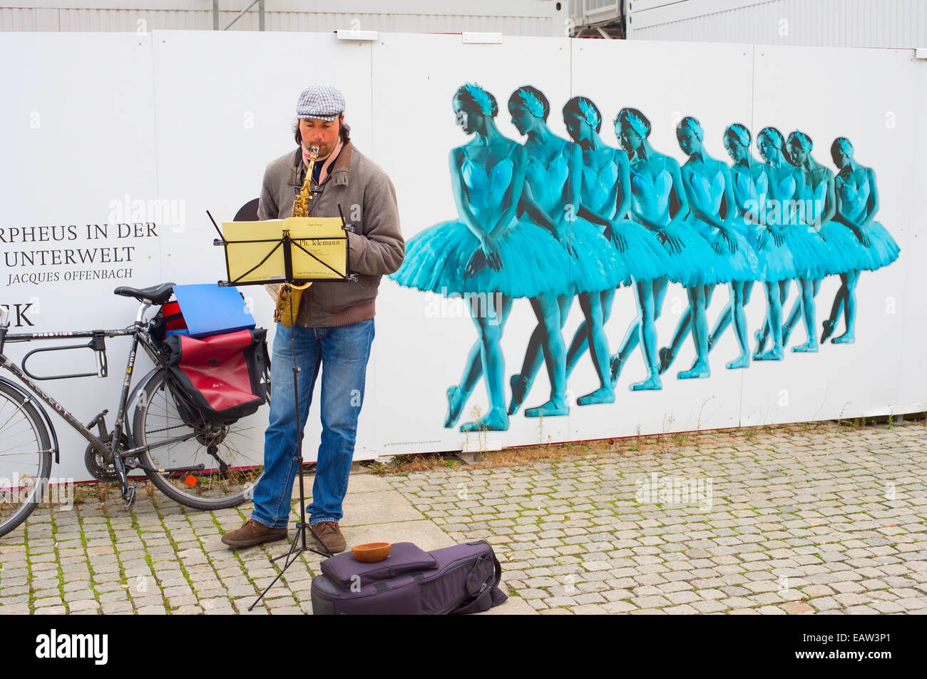 Unedentified musician playing music on the Berlin street. Stock Photo