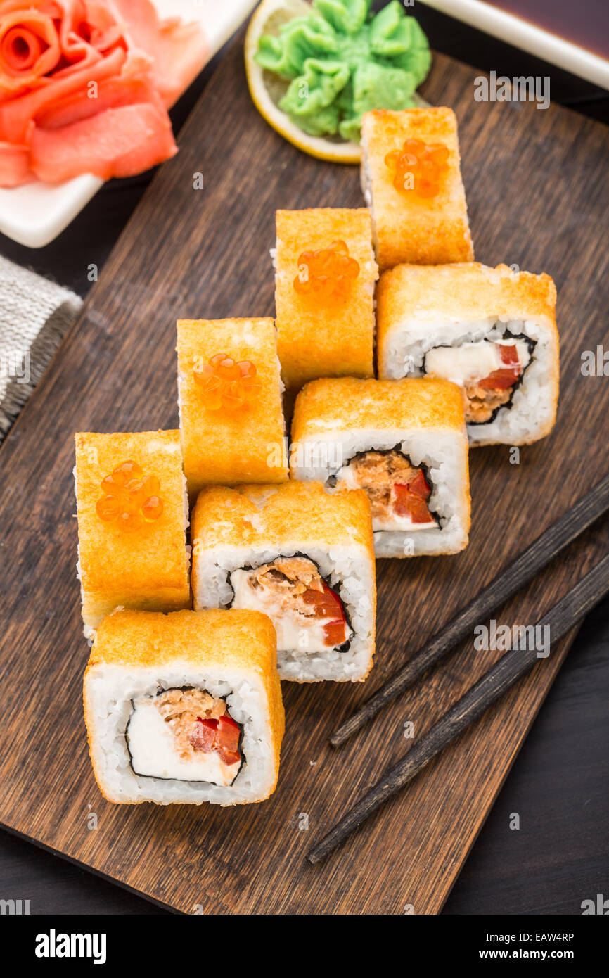 Fried sushi roll with salmon teriyaki Stock Photo