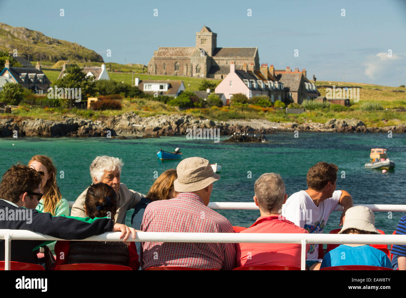 Iona Abbey with passengers on the Iona ferry, Scotland, UK. Stock Photo