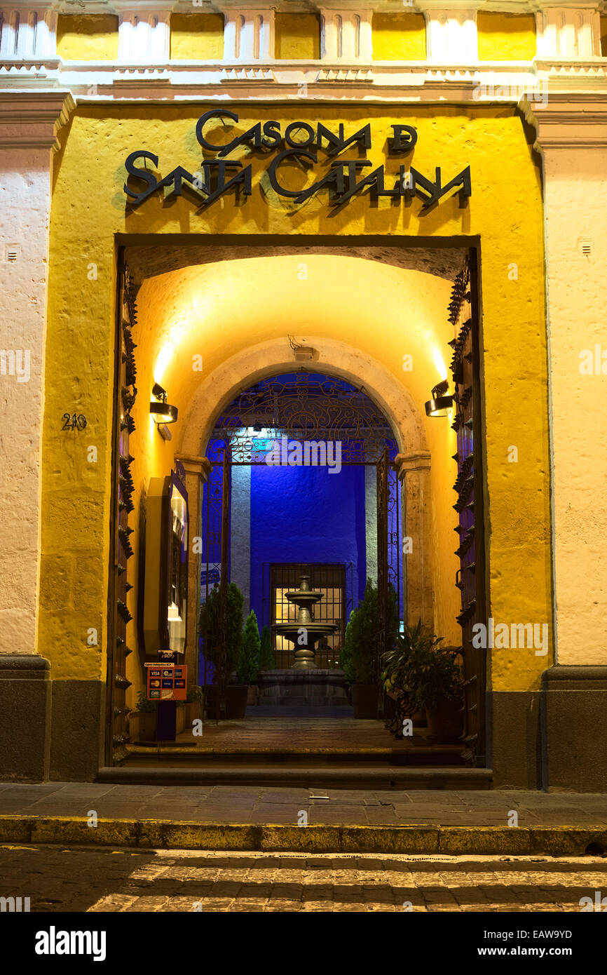 Entrance of the Casona de Santa Catalina on Santa Catalina street in the city center in Arequipa, Peru lit in the evening Stock Photo