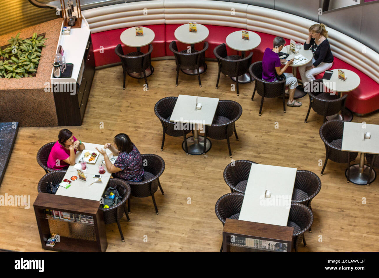 View looking down on diners at mall restaurant. Stock Photo