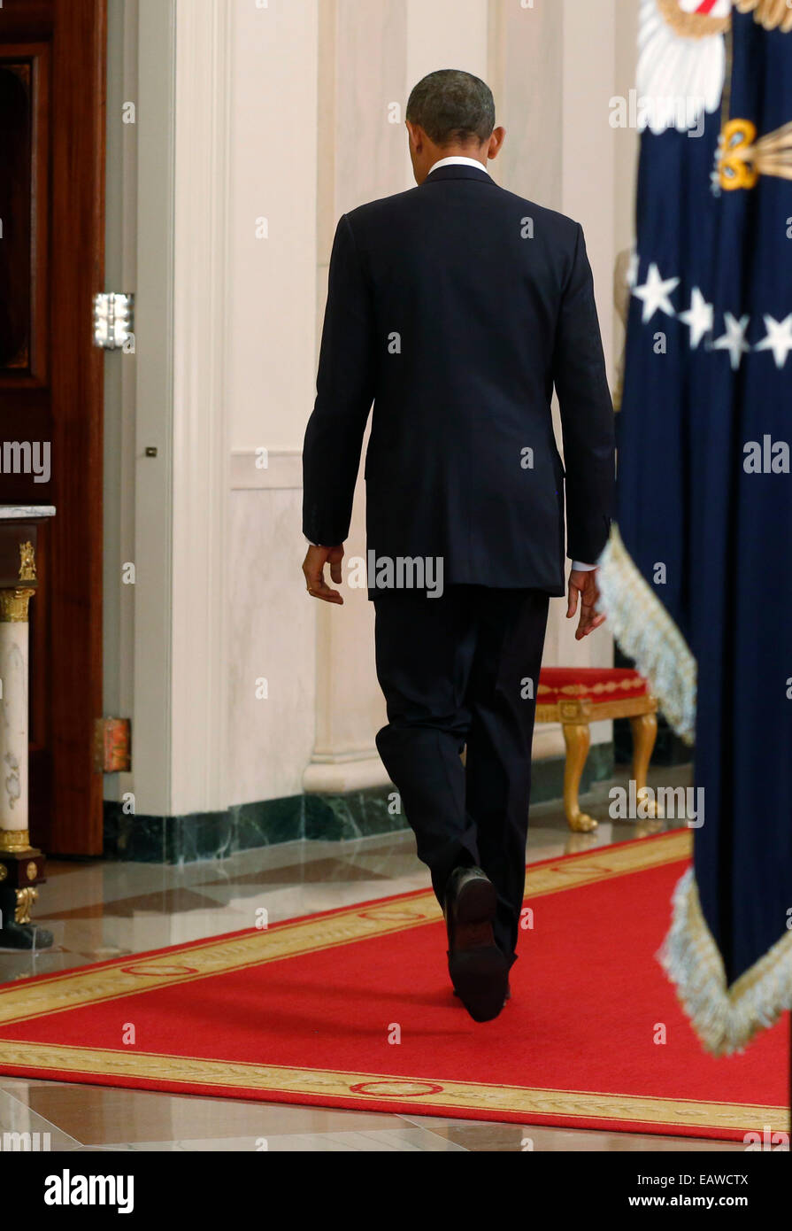 Washington DC, USA. 20th November, 2014. United States President Barack Obama departs after announcing executive actions on U.S. immigration policy during an address from the White House in Washington, November 20, 2014. Obama outlined a plan on Thursday to ease the threat of deportation for about 4.7 million undocumented immigrants. Credit: Jim Bourg/Pool via CNP - NO WIRE SERVICE - Credit:  dpa picture alliance/Alamy Live News Stock Photo