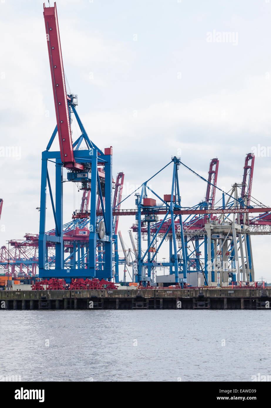 Cargo cranes at the container terminal 'Burchardkai' at Hamburg harbor. Stock Photo