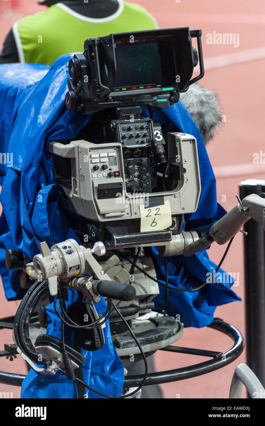 A professional TV camera in use at a sports event. Stock Photo