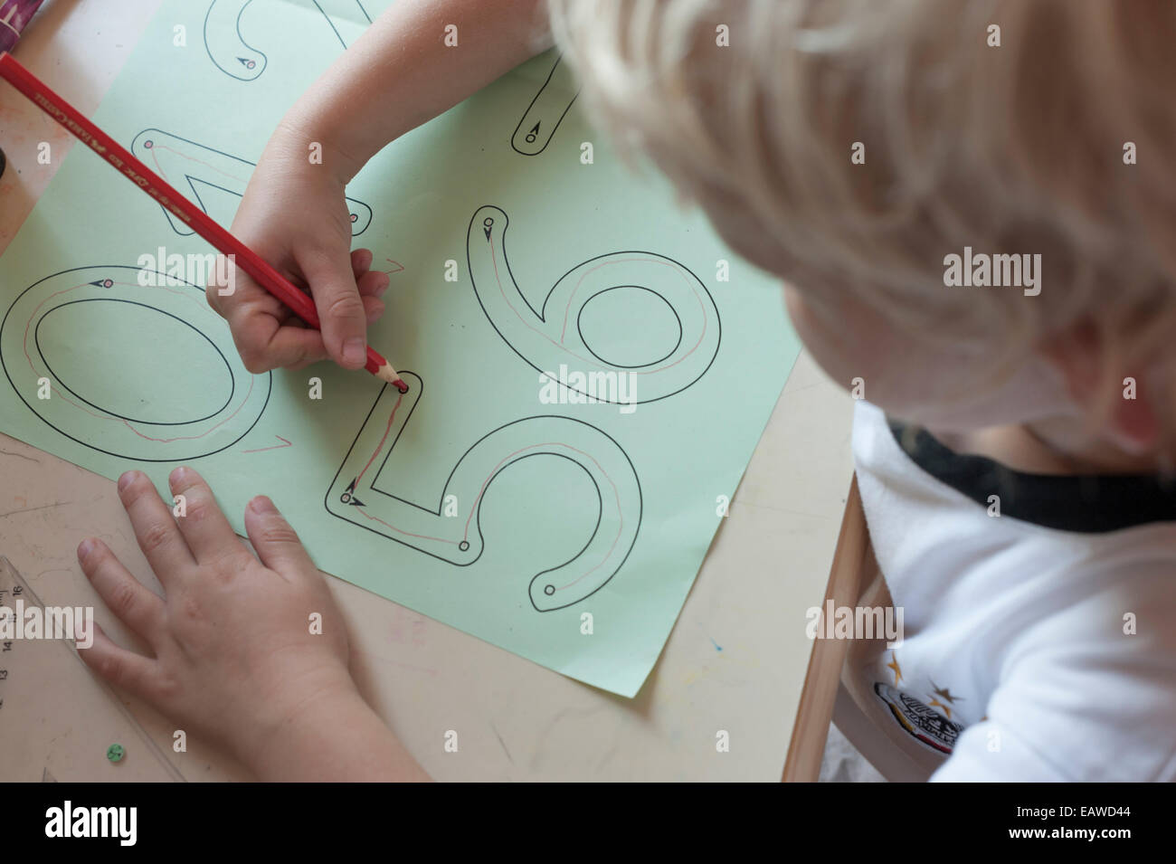 A 7 year Old Schoolchild Is Doing Writing Exercises As Homework For a-7-year-old-schoolchild-is-doing-writing-exercises-as-homework-for