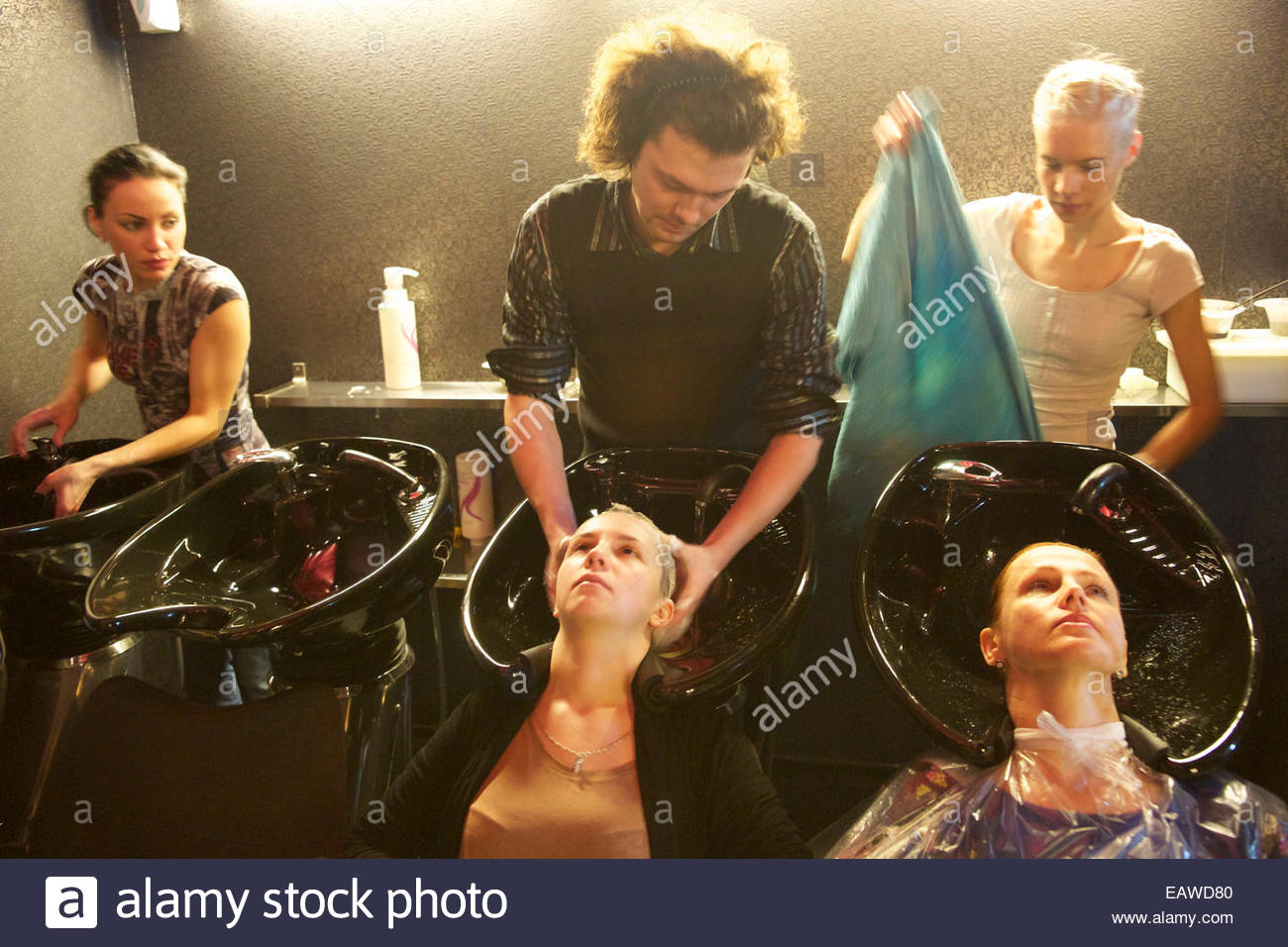A Hair Stylist At His School Improving His Education Stock Photo