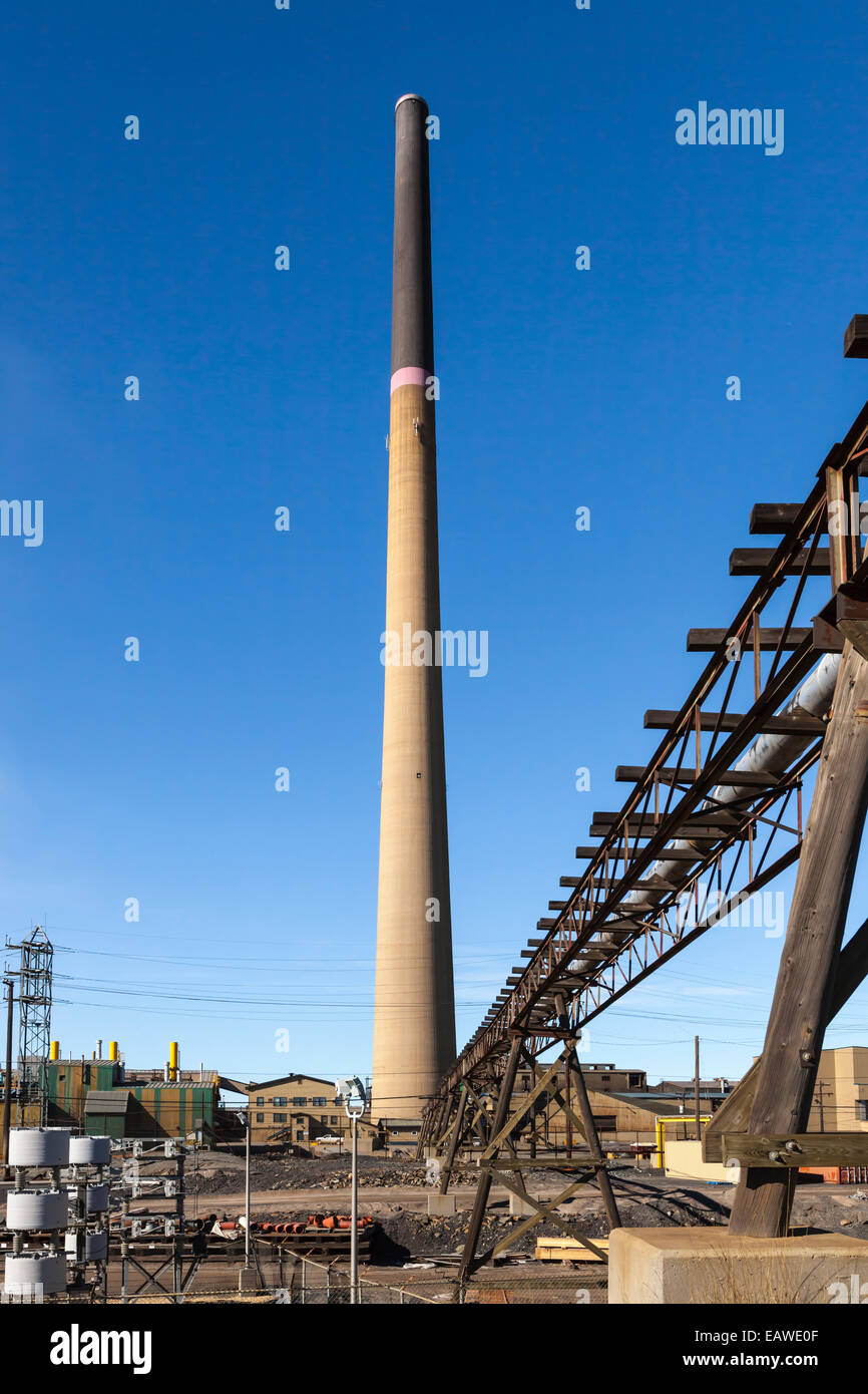 A tall smoke stack chimney at the Hudson's Bay Mining and Smelting Co