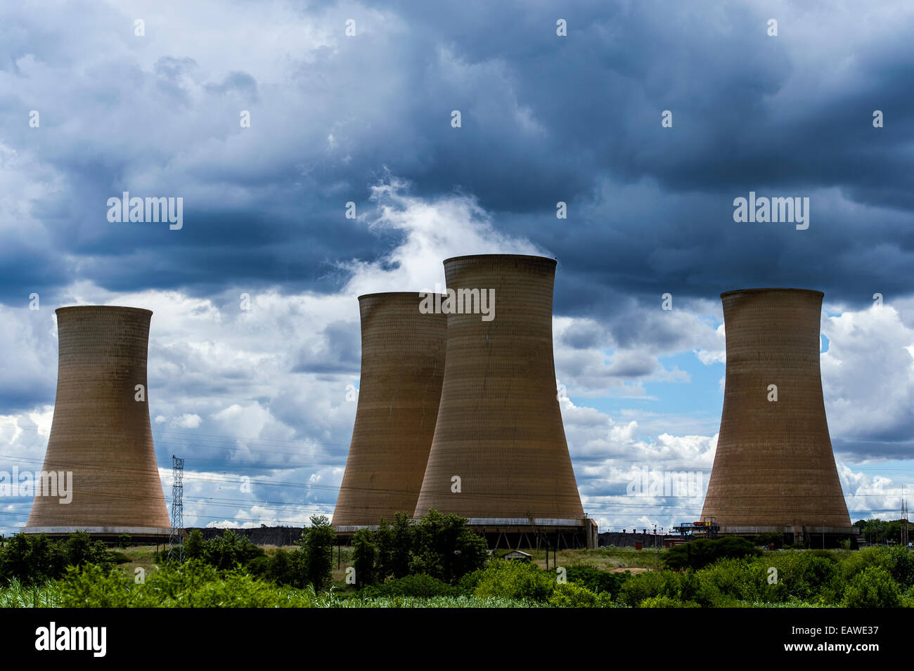 Steam rises from the cooling towers of an electricity power station. Stock Photo