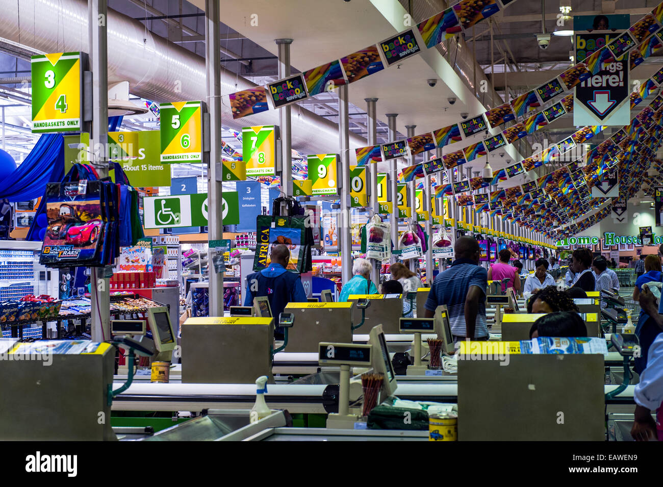 An enormous row of check-out cash registers in a supermarket mall. Stock Photo