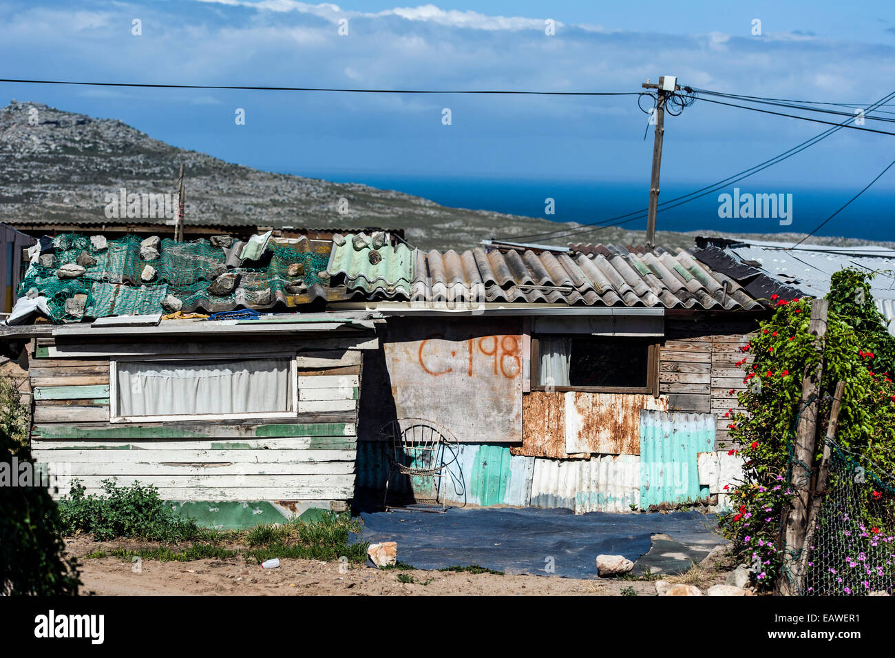 Township homes made of scrap metal for displaced African refugees. Stock Photo