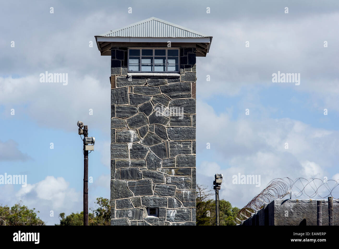 Windows of a guard post look out from a stone prison watch tower. Stock Photo