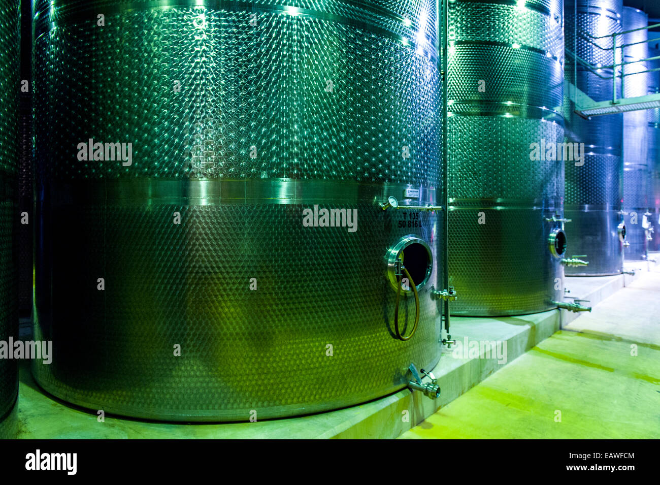 A winery uses sterile stainless steel tanks to ferment the wine. Stock Photo