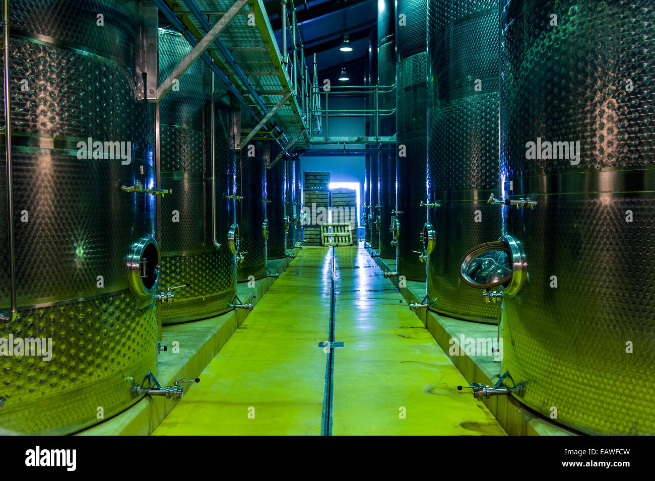 A winery uses sterile stainless steel tanks to ferment the wine. Stock Photo