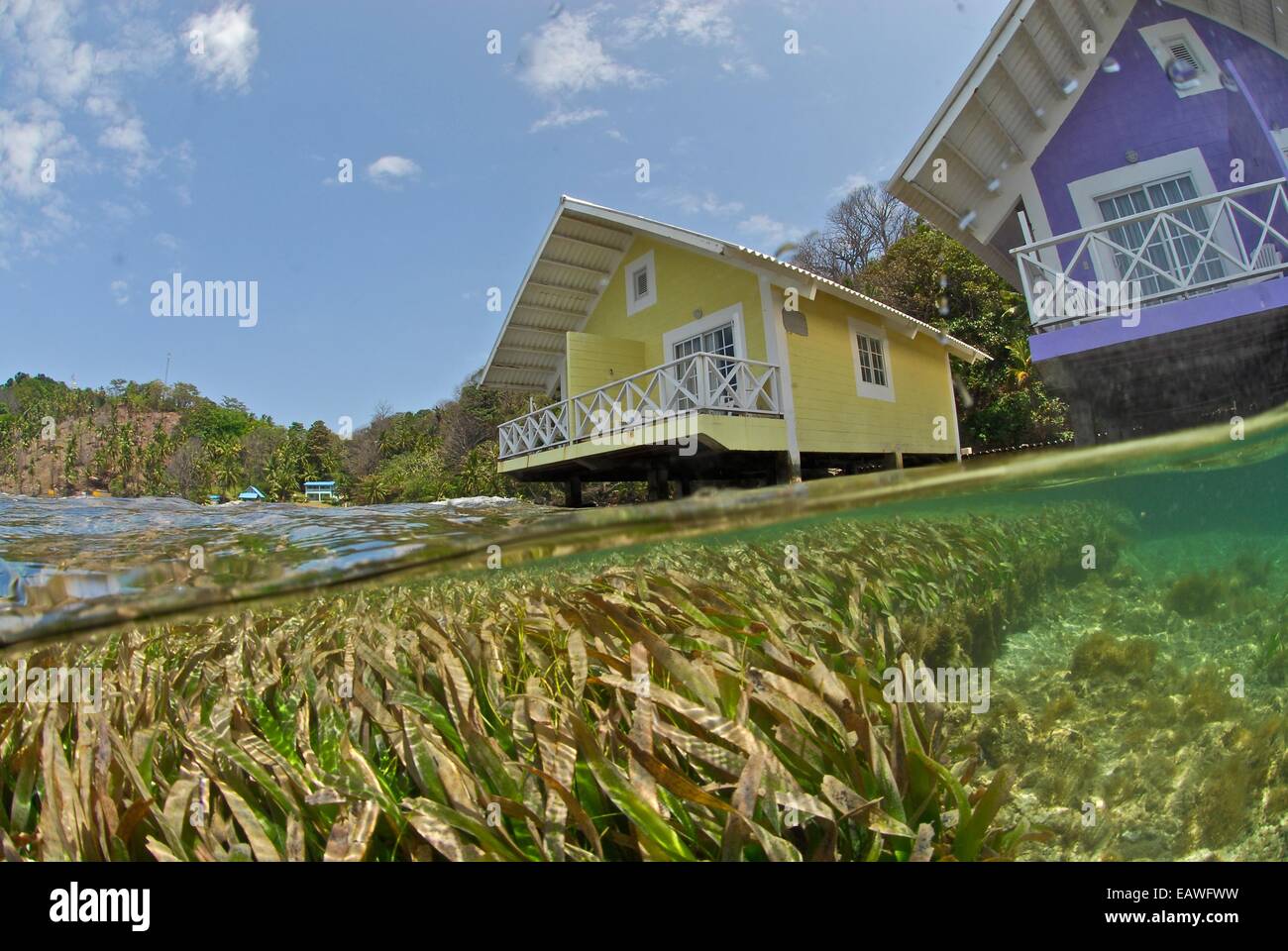 Vacation villas overlook the shallow waters of the Caribbean. Stock Photo