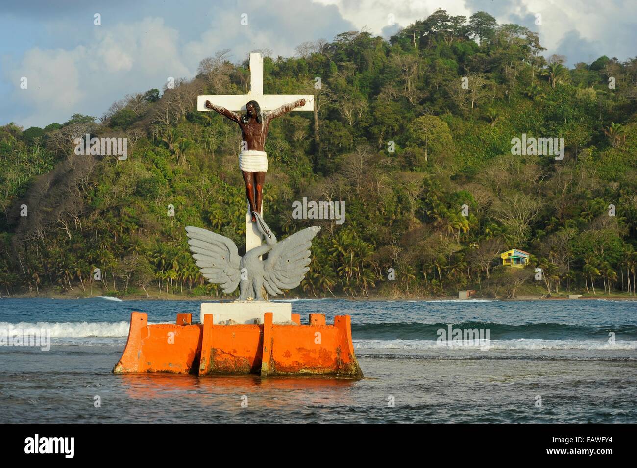 The statue of The Black Christ rises from the surf off Isla Grande. Stock Photo
