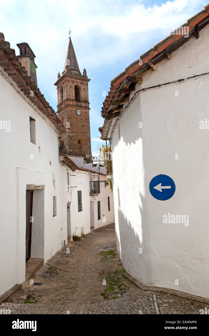 One way road sign pointing down a very narrow street, village of Alajar, Sierra de Aracena, Huelva province, Spain Stock Photo