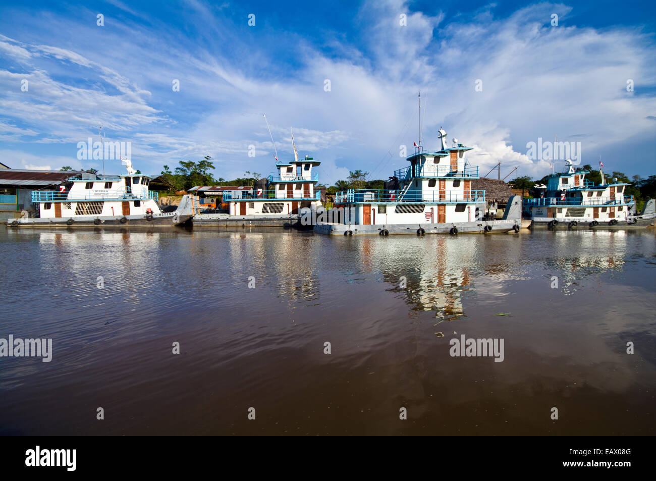 Logging barges and houseboats moored by the shore of the Amazon River and Nanay confluence. Stock Photo