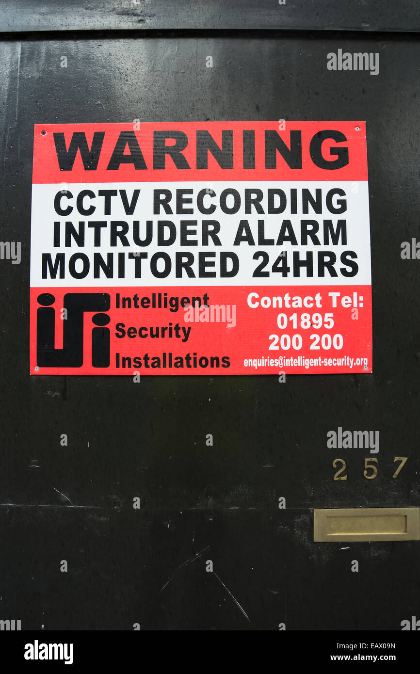 cctv warning notice on a door Stock Photo