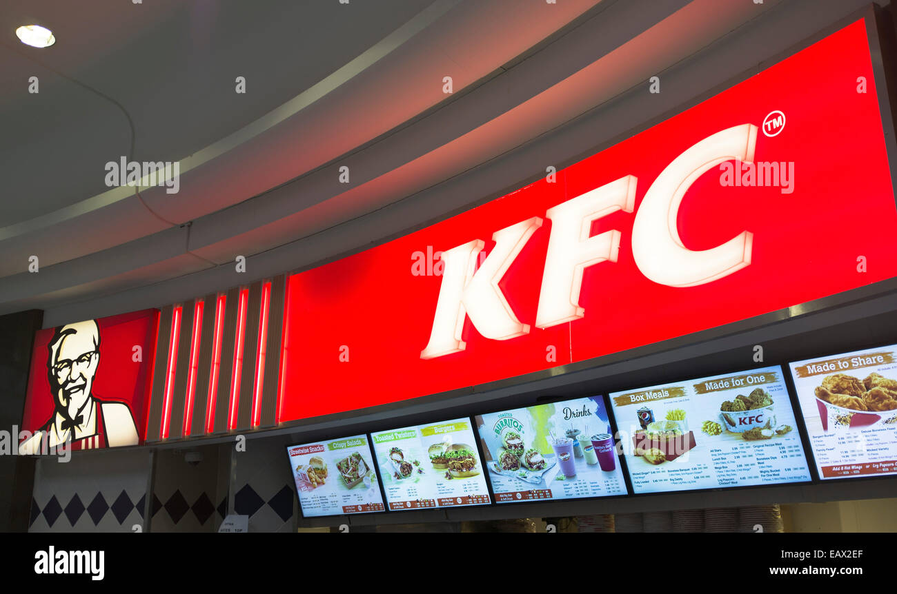 dh KFC FASTFOOD UK Kentucky Fried Chicken logo sign above menus board menu Stock Photo