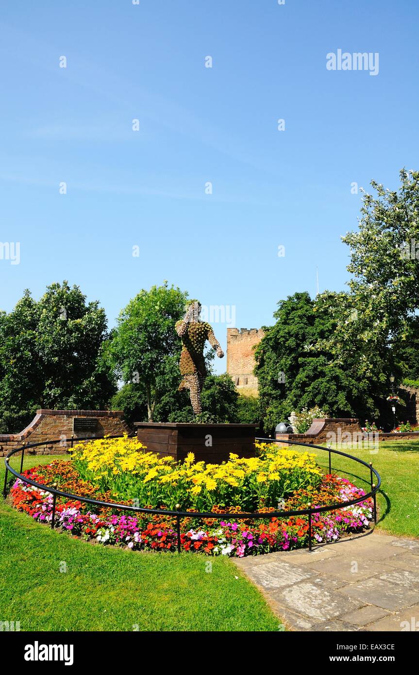 Floral statue at the centre of a round flowerbed within the castle