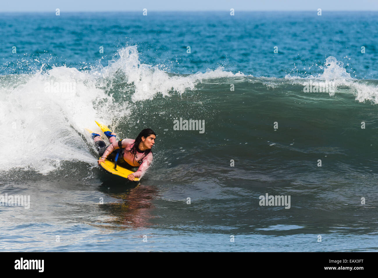Boogie boarder riding a wave Stock Photo Alamy