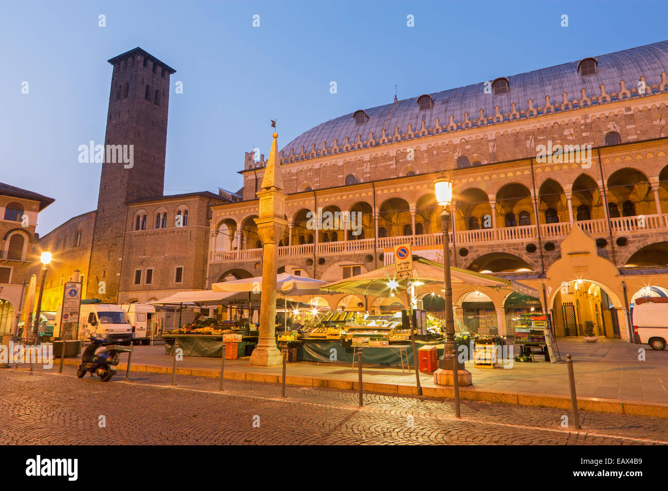 PADUA, ITALY - SEPTEMBER 9, 2014: Piazza della Fruta in morning dusk with the market and Palazzo dalla Ragione. Stock Photo