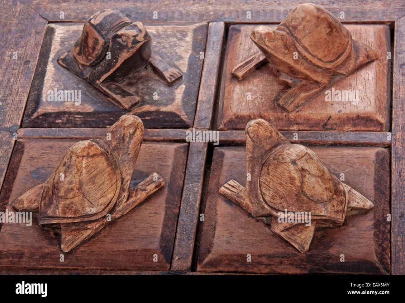 carved wooden turtles on trinket box compartment lids Stock Photo