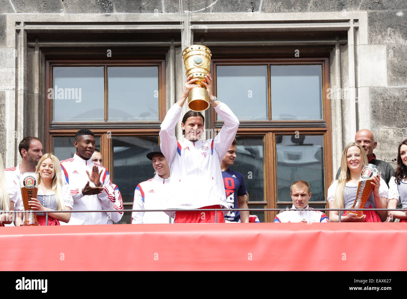 Bayern Muenchen presenting the trophy to the fans at Marienplatz after winning the DFB Cup Final match.  Featuring: Daniel Van Buyten Where: Munich, Germany When: 18 May 2014 Stock Photo