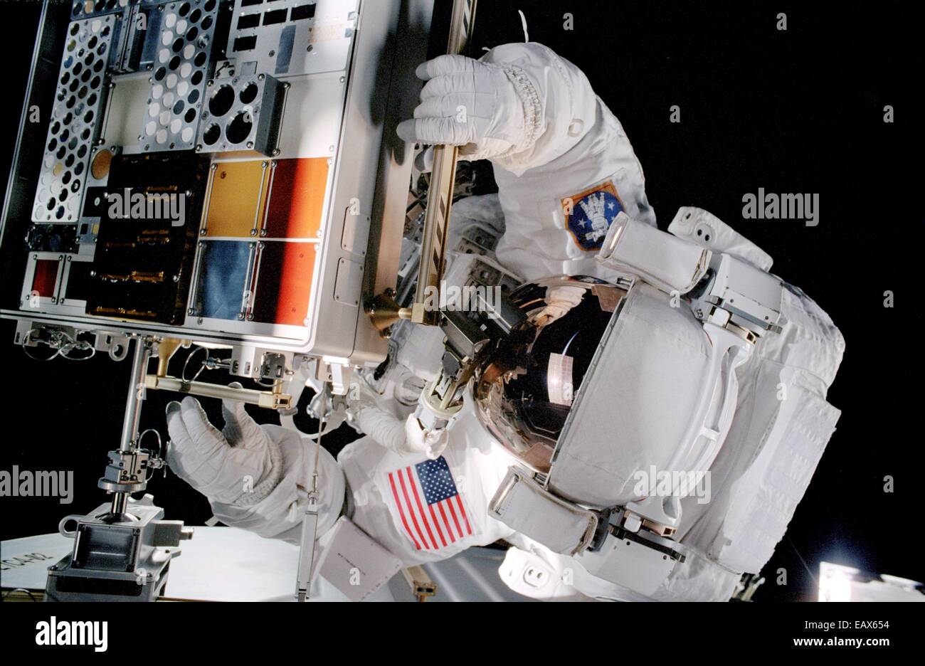 US astronaut Patrick Forrester works on the Materials International Space Station Experiment Passive Experiment Container installed on the International Space Station Airlock during a spacewalk October 27, 2010 in Earth Orbit. Stock Photo
