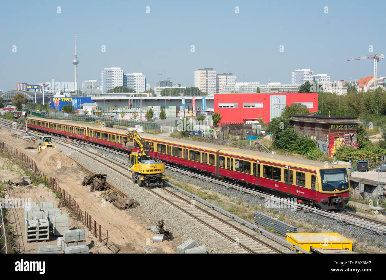 A DB S Bahn train passes rail engineering work close to Warschauer Straße station Stock Photo