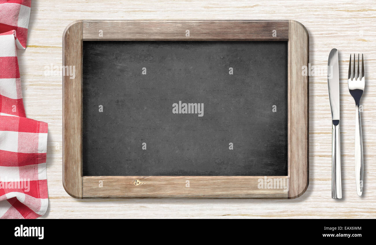 Menu blackboard top view on table with knife and fork Stock Photo