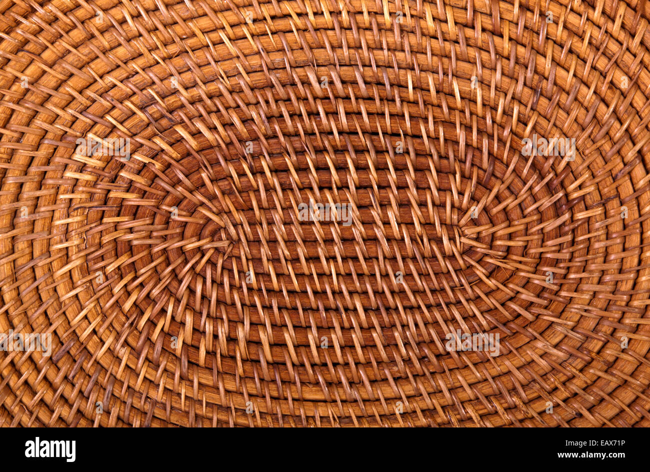 closeup of traditional woven grass mat in circular pattern Stock Photo
