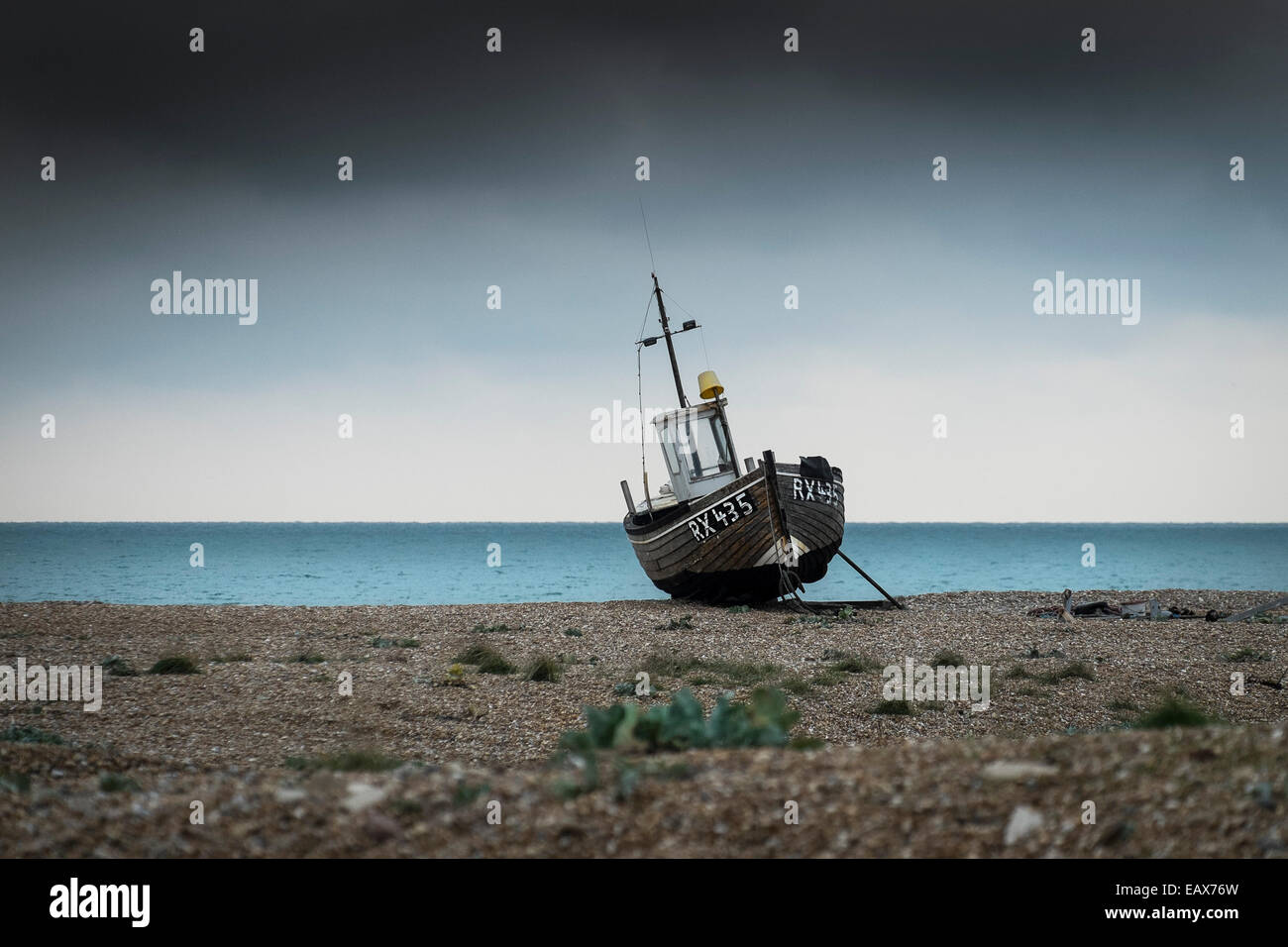 The small fishing boat  RX 435 beached at Dungeness in Kent.  A site of special scientific significance. Stock Photo