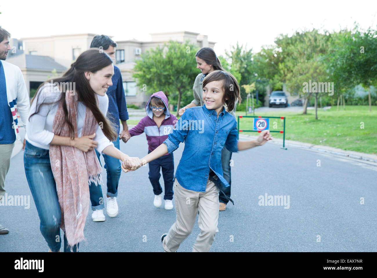 Family playing together outdoors Stock Photo