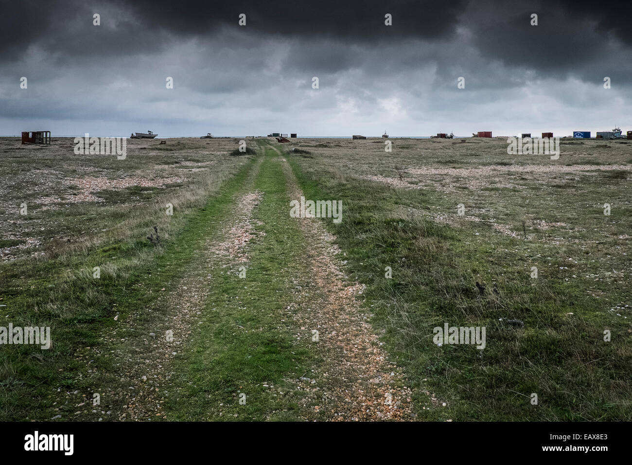 A track running across the foreland at Dungeness in Kent.  A site of special scientific significance. Stock Photo