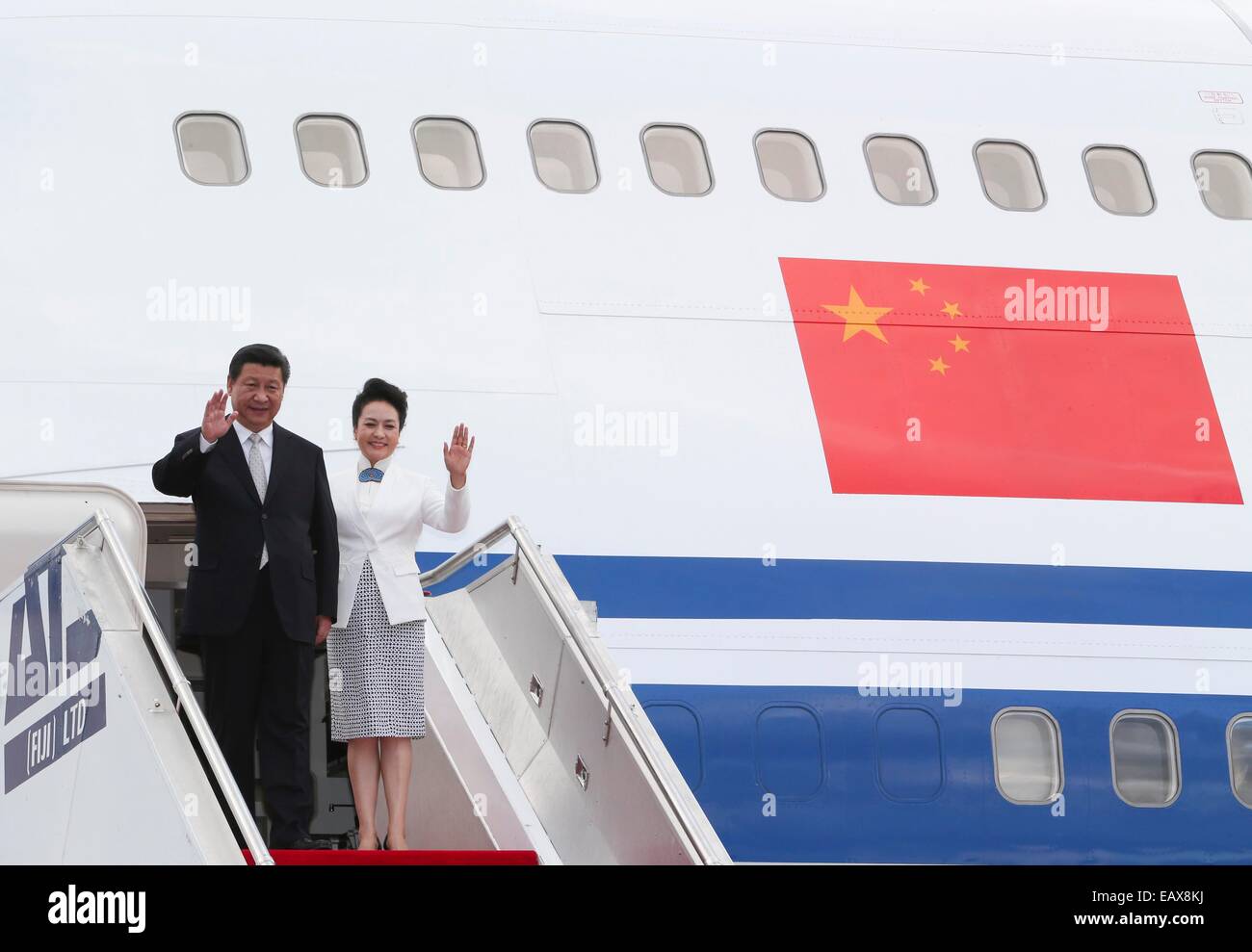 Nadi, Fiji. 21st Nov, 2014. Chinese President Xi Jinping (L) and his wife Peng Liyuan step out of the plane upon their arrival at the airport in Nadi, Fiji, Nov. 21, 2014. Xi is paying a state visit to Fiji, the first in history by a Chinese president. © Ding Lin/Xinhua/Alamy Live News Stock Photo