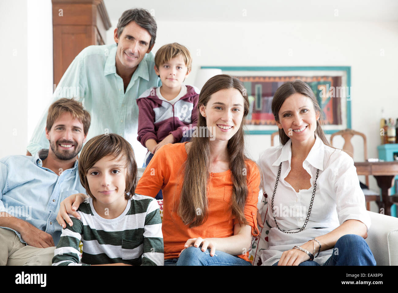 Family together in living room, portrait Stock Photo