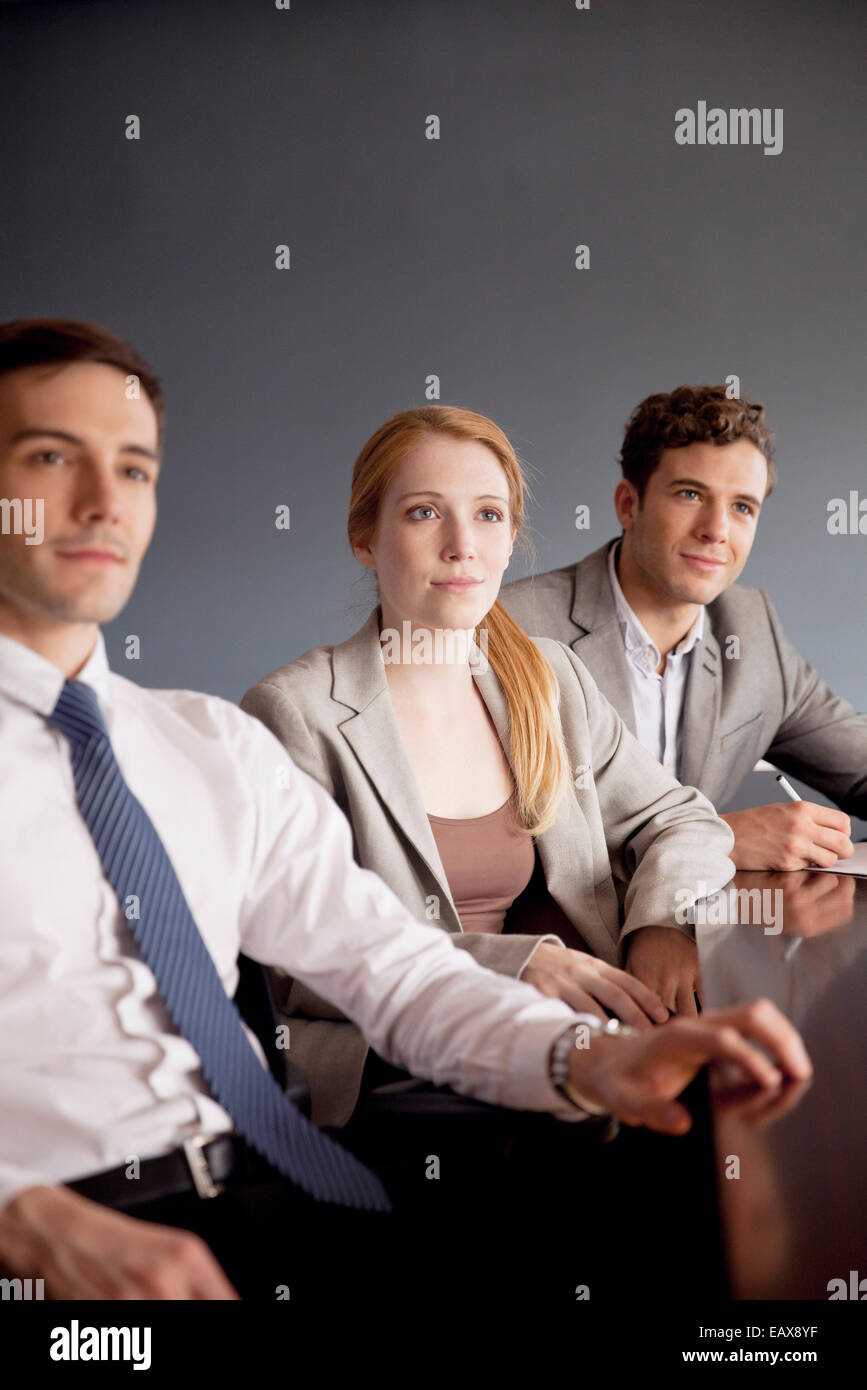 Young business professionals attending presentation Stock Photo