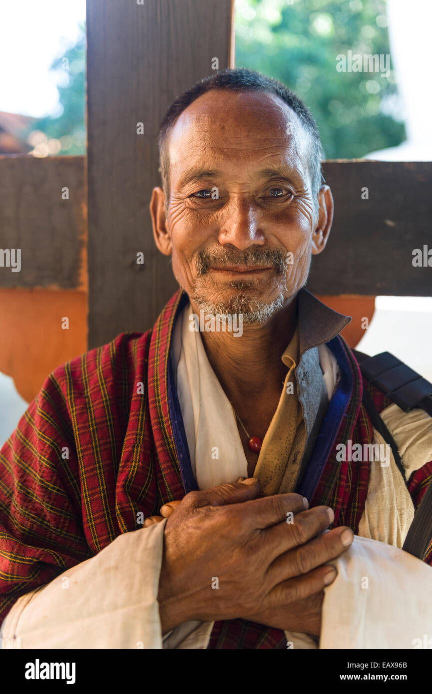 Farmer in Punakha Dzong with Bhutanese national dress and official scarf Stock Photo