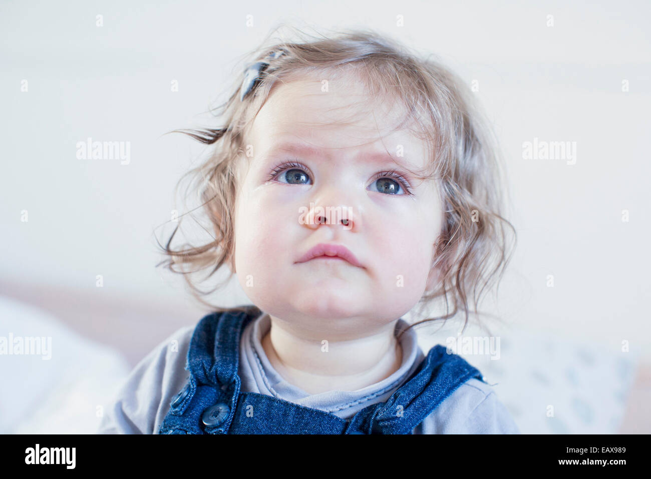 Baby girl looking up, portrait Stock Photo