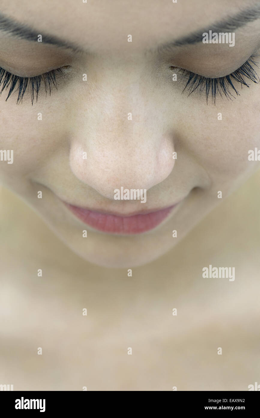 Young woman with eyes closed, close-up Stock Photo