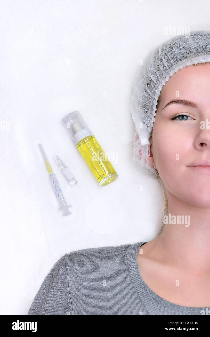 Young woman in spa salon is waiting for injections Stock Photo