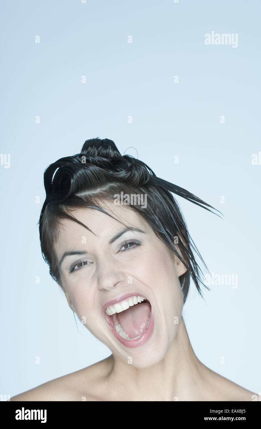 Woman With Spiky Hairstyle Mouth Open Portrait Stock Photo