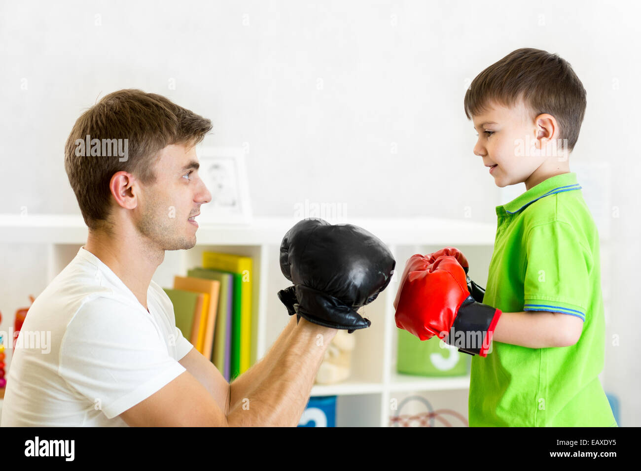 kid boy and father play boxing Stock Photo