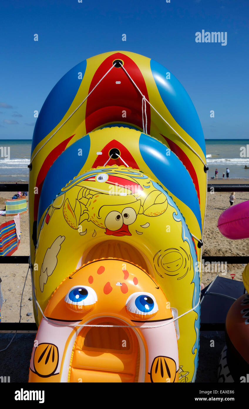 Colourful inflatable dinghies for sale at the beach at Mundesley
