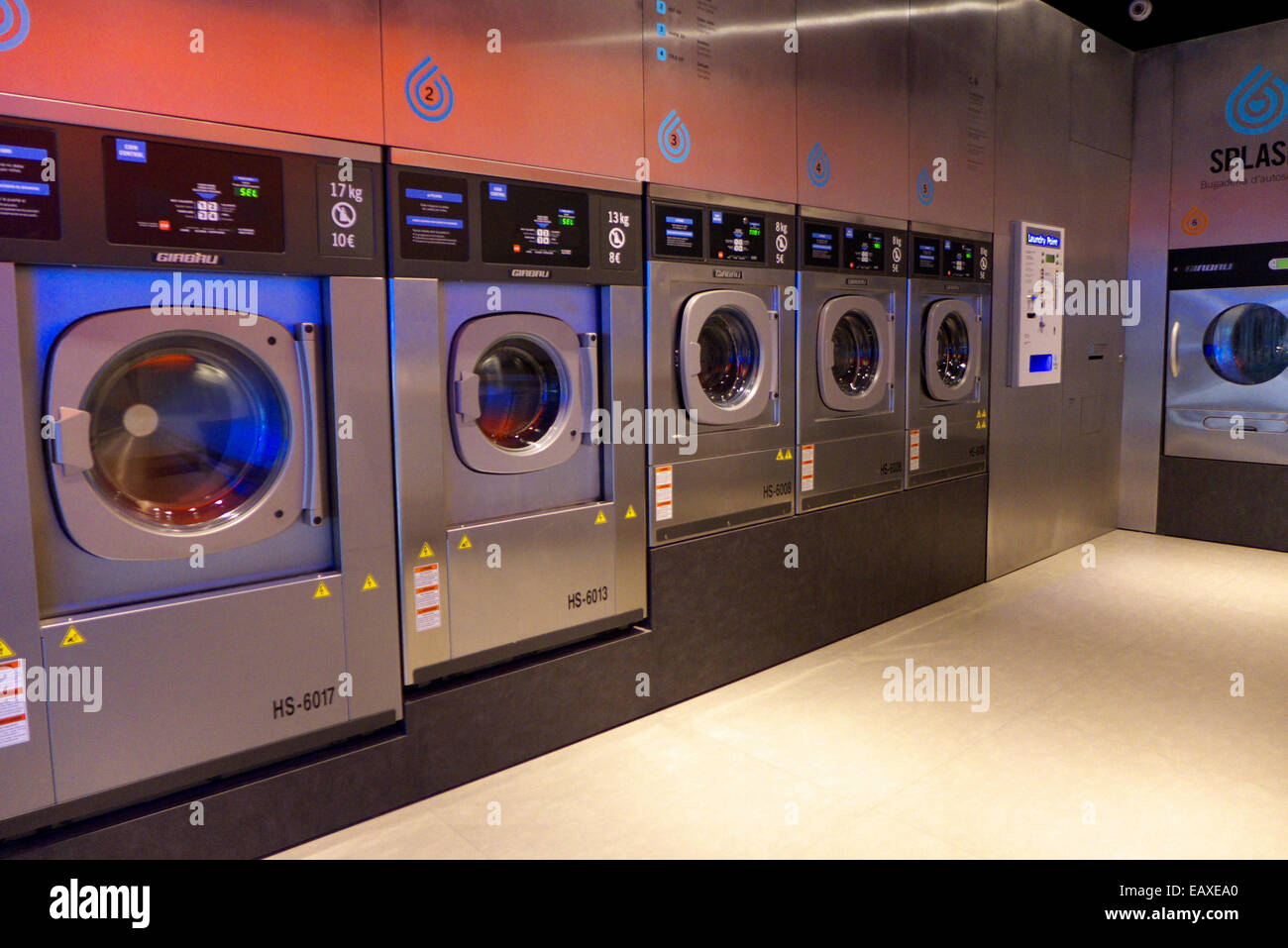 Spain Catalonia Barcelona Splash automatic laundry self-service Stock Photo  - Alamy