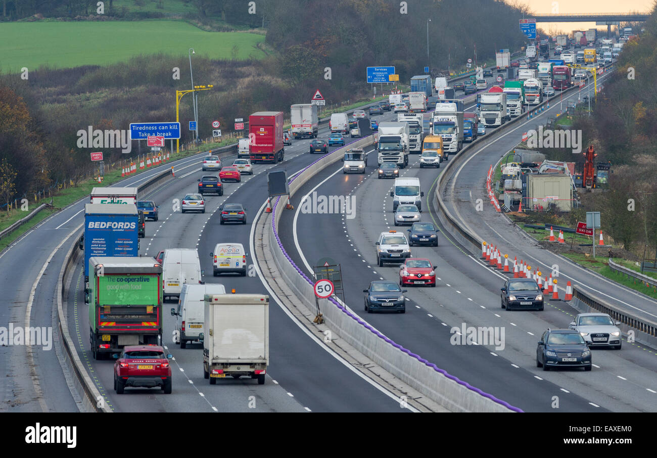 Heavy motorway traffic going through road works on the M1 in Stock