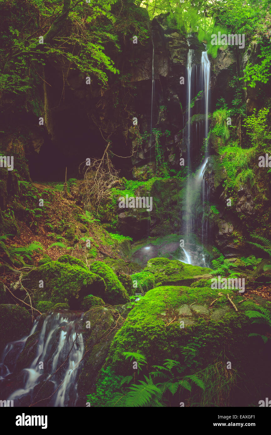 Waterfall and black cave , Cascade des Razes, Ferrieres-Saint-Mary ...